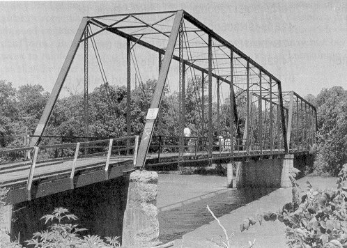 The two Pratt through trusses of Bridge 58E0062N4510004 date from 1901 when originally erected as a toll bridge across the Neosho River at Miami.  Now it is the Stepp Ford Bridge near Commerce.