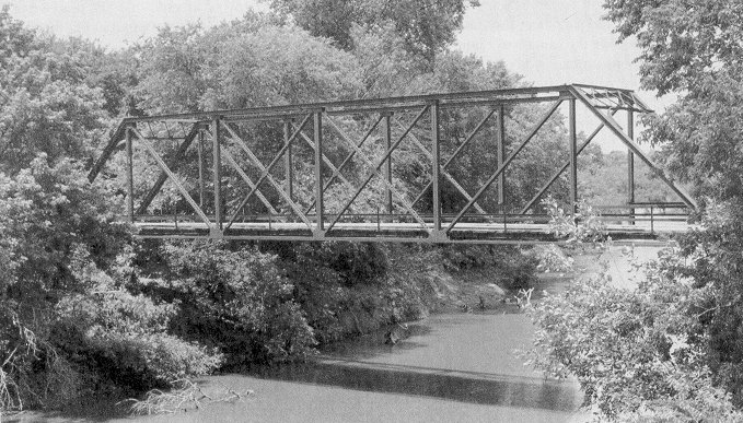 Characteristically strong in design and fragile in appearance the Pratt through truss bridge was extensively used in Oklahoma.   Bridge 17E1961N2640002, built in 1913, crossed Cache Creek in Cotton County.