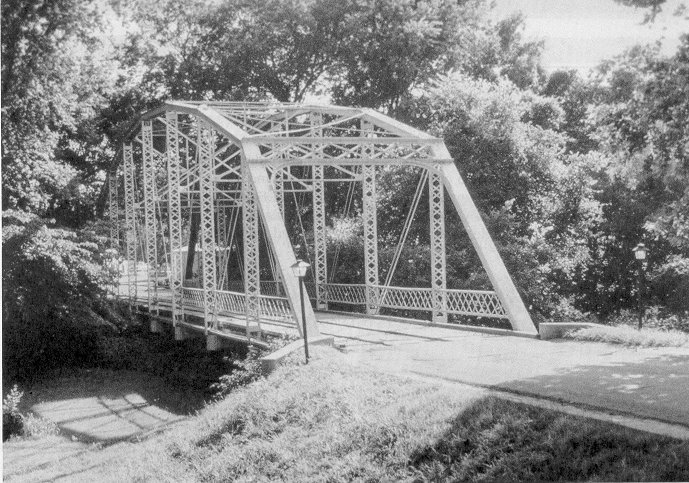 A 1909 Parker through truss, that once formed a part of the Jenks Bridge across the Arkansas River, now makes a splendid entrance to a mobile home park in Tulsa.