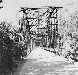 Four modified Parker through truses form the main spans of Bridge 51E0835N4350004.  The 1926 structure crosses the Grand River at Fort Gibson.