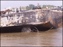 Barge On Hit Pier