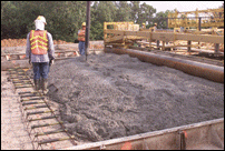 Pumping Concrete into Roadway Forms