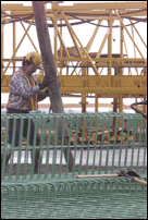 Worker Placing Concrete on Span One